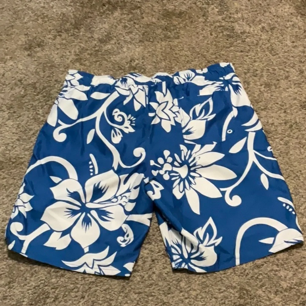 Old Navy blue & white floral swimming trunks. Size XL (40-42)